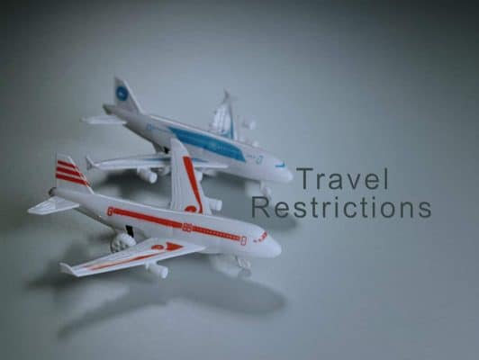 toy airplane with text travel restriction concept due to pademic of covid19